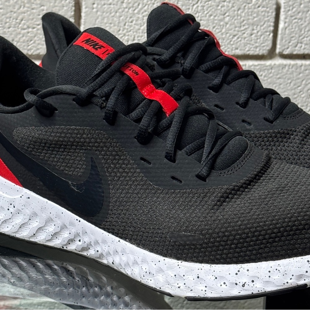 Nike Revolution 5 running shoes in men’s size 13.
